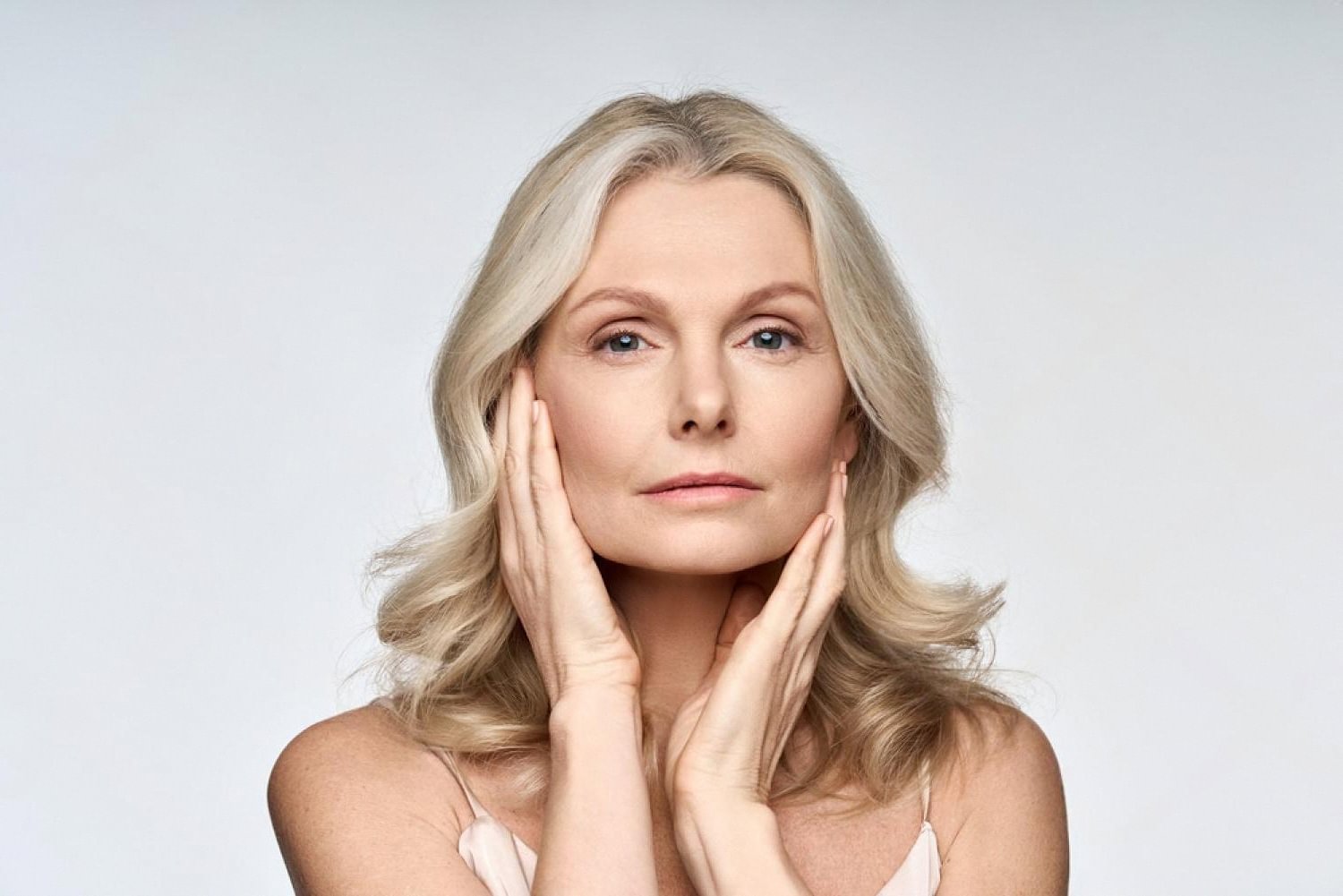 Woman with smooth skin showcasing results of collagen-boosting facial treatment