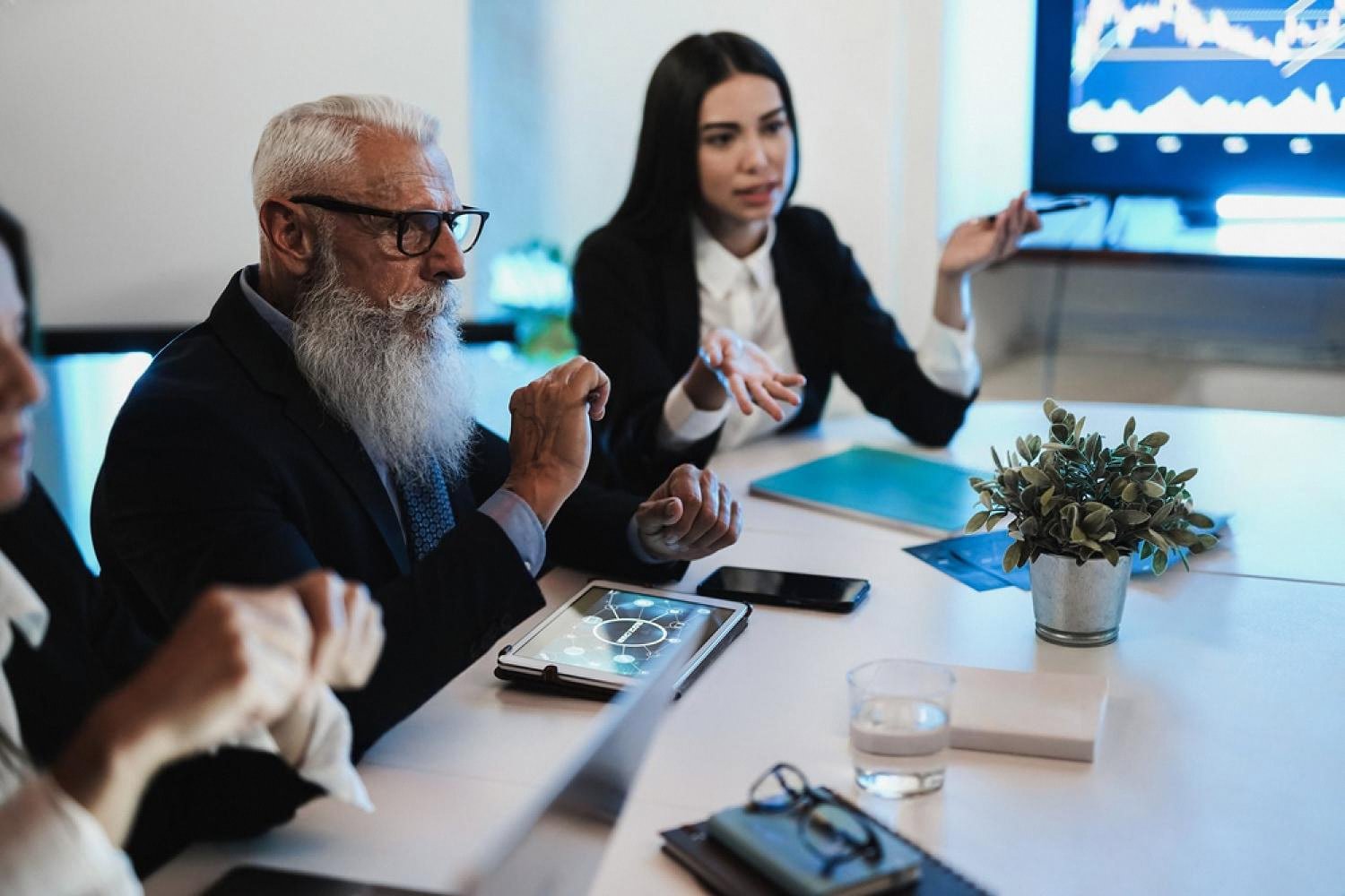 UAE executives reviewing due diligence findings in a boardroom